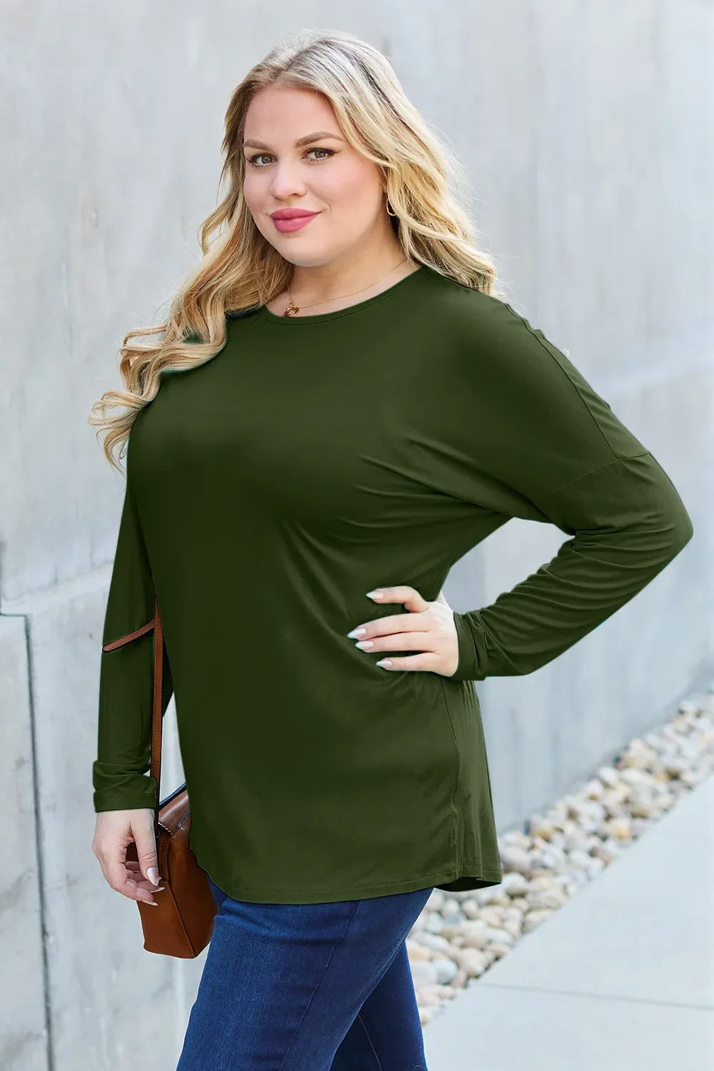 Army green relaxed long-sleeve tee, three-quarter view with crew neck and drape