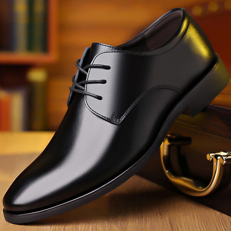 Men's black leather lace-up oxford dress shoes, stitched seam detail.