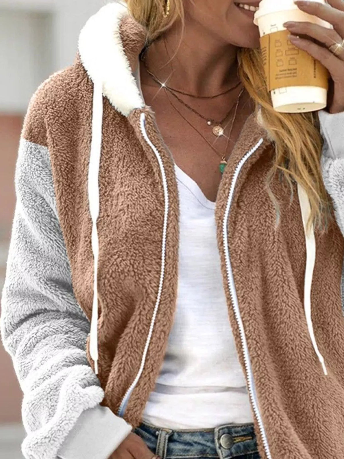 Tan fleece zip-up hoodie with hood, white trim, contrasting light gray sleeves and cuffs