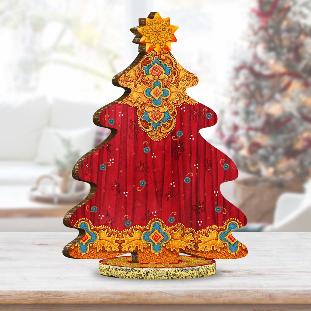 Back view of decorated wooden Christmas tree figurine with red fabric and gold trim