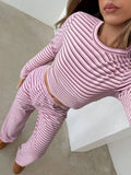 Pink striped long-sleeve crop top and wide-leg matching pants set