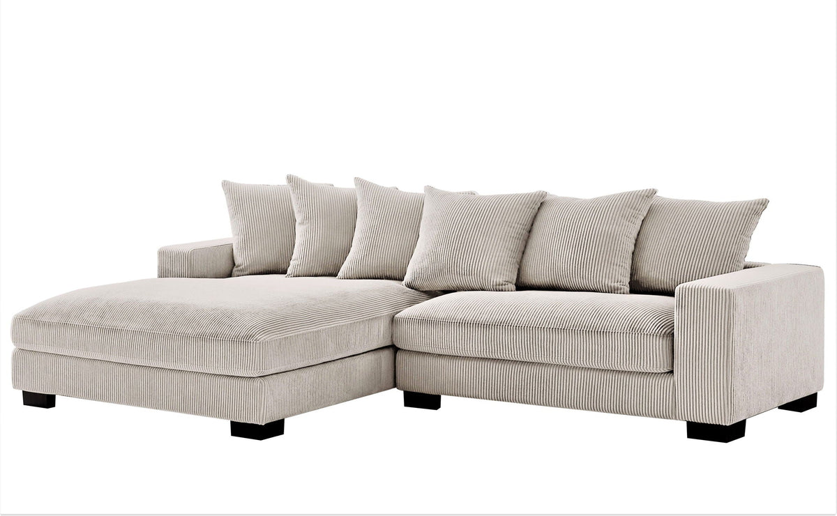L-shaped sectional sofa with chaise in light beige, soft cushions and back throw pillows