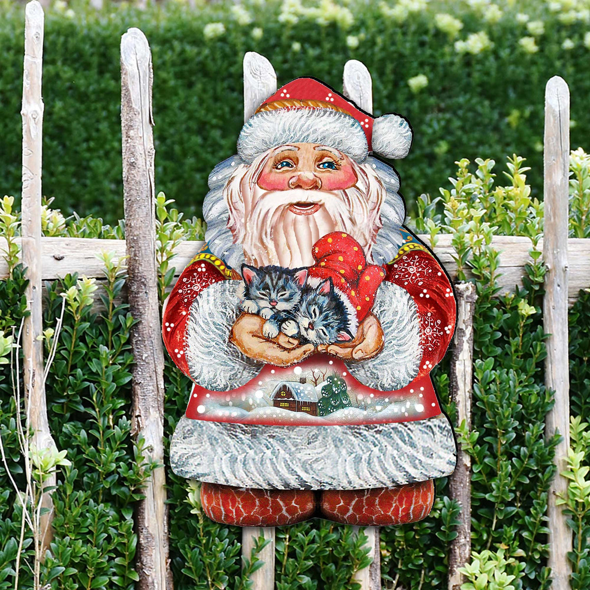 Santa holding a kitten Christmas door decor figure mounted on stakes in greenery