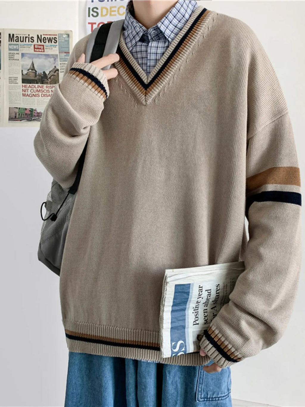 Men's khaki V-neck long-sleeve sweater with navy and tan contrast stripe bands