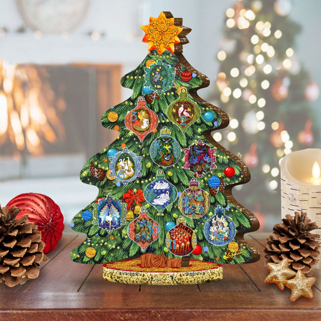 Decorated wooden Christmas tree centerpiece figurine with colorful ornament cutouts and gold topper