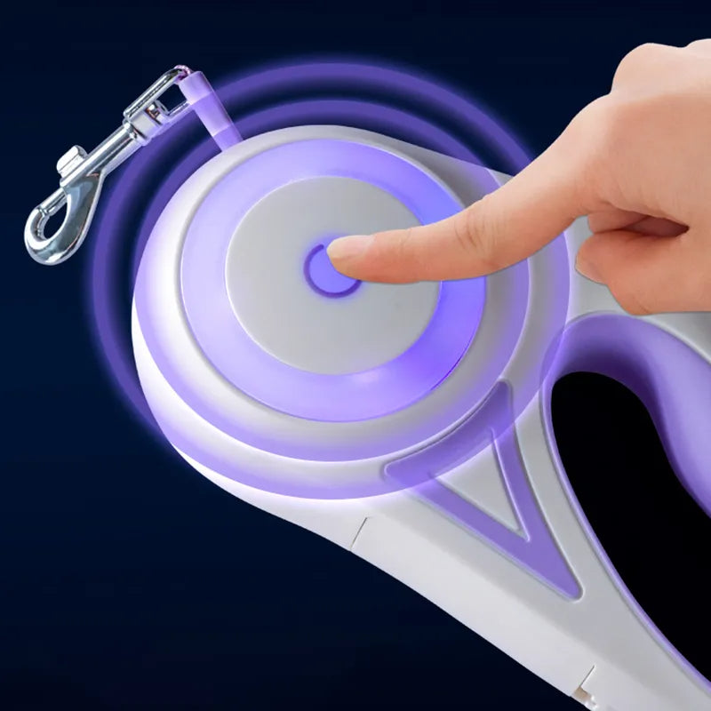 Purple LED retractable pet leash with chrome clasp and glowing ring, hand pressing button