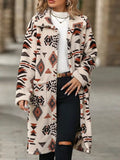 Geometric longline button-up coat in cream with red and black patterns, open front.