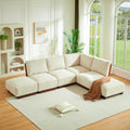 L-shaped modular boucle sectional sofa with light sesame upholstery and dark wood legs