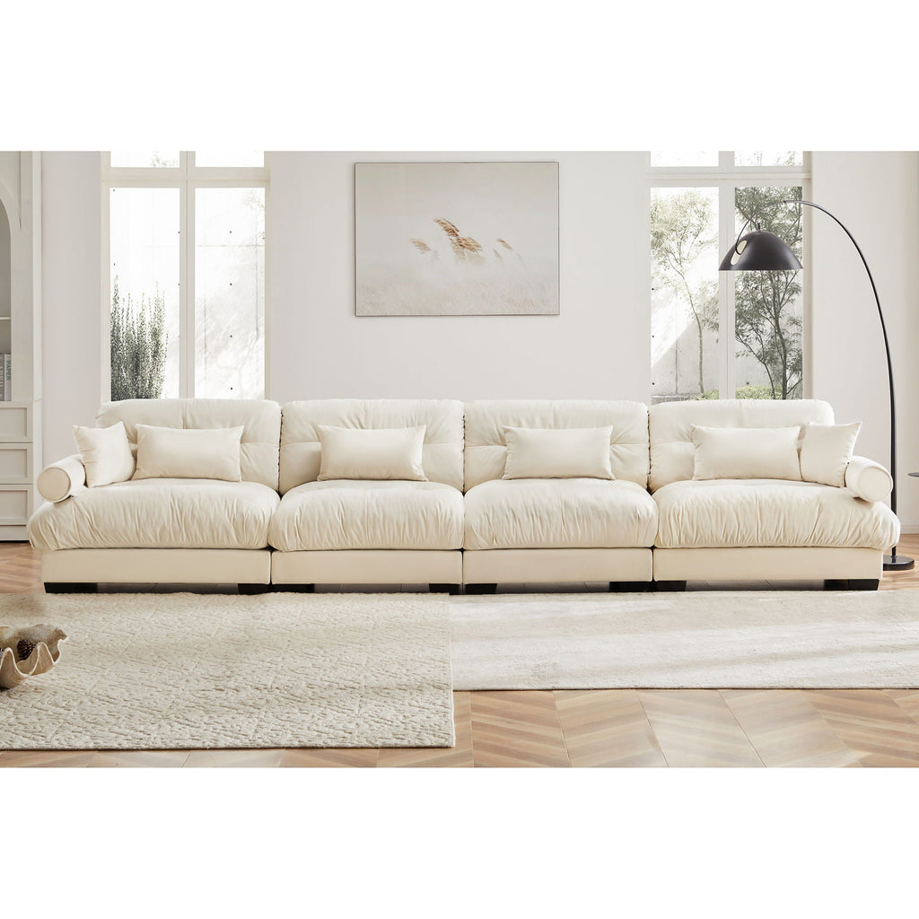 Beige modular sectional sofa with deep seat, rolled arms, and multiple back cushions