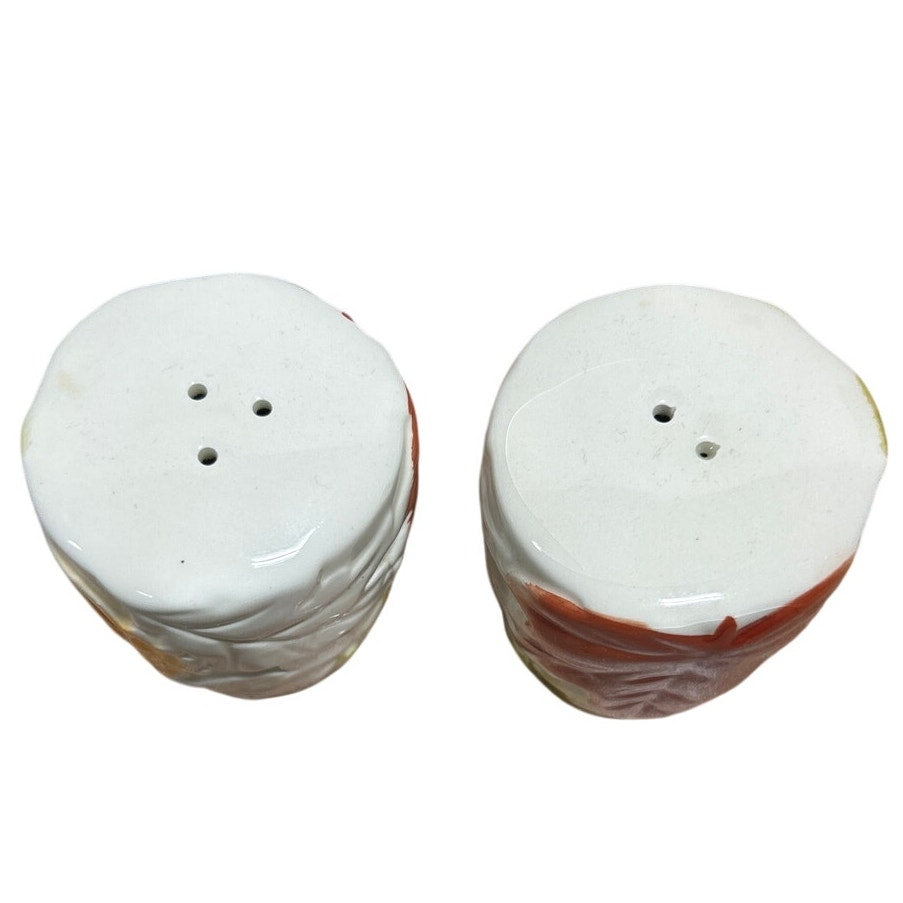 Ceramic salt and pepper shaker set, white tops with two and three seasoning holes