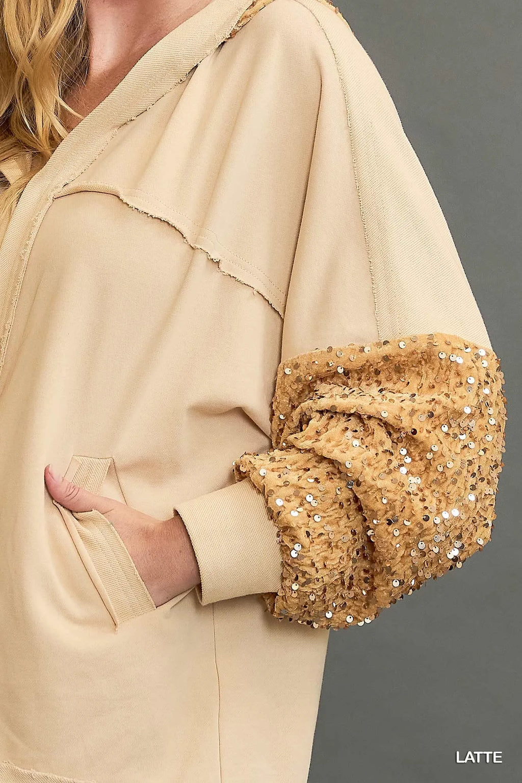Latte sequin French terry hoodie jacket close-up, sequined hood edge and sleeve cuff