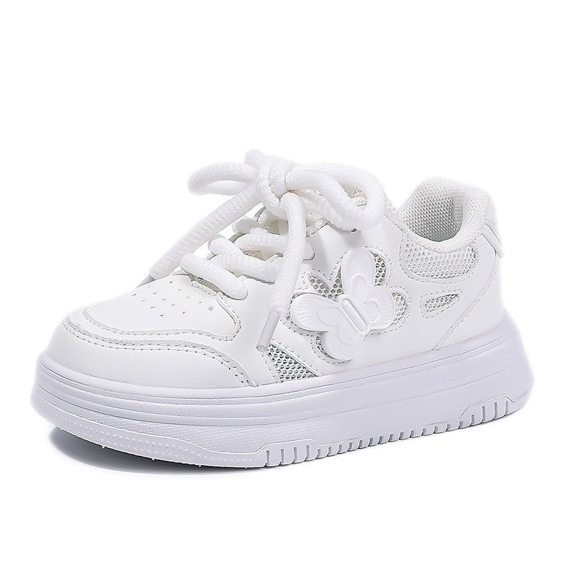 White kids' low-top sneaker with butterfly logo, lace-up and padded collar, front view.