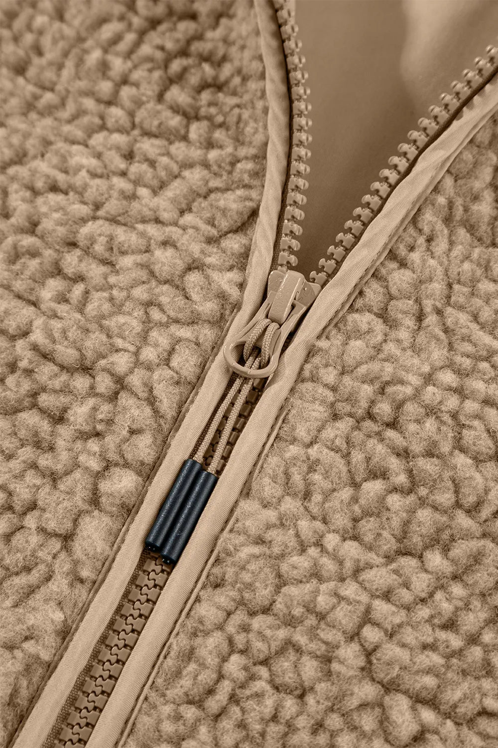 Khaki fleece jacket zipper detail with front zip and stitched trim
