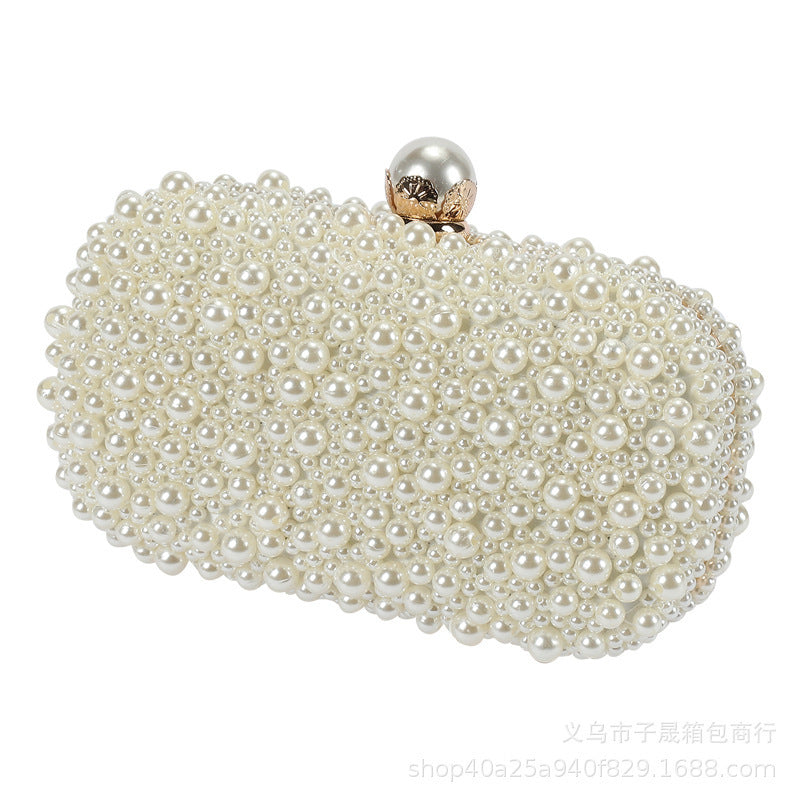 White pearl bead dinner clutch with round metal clasp, close-up front