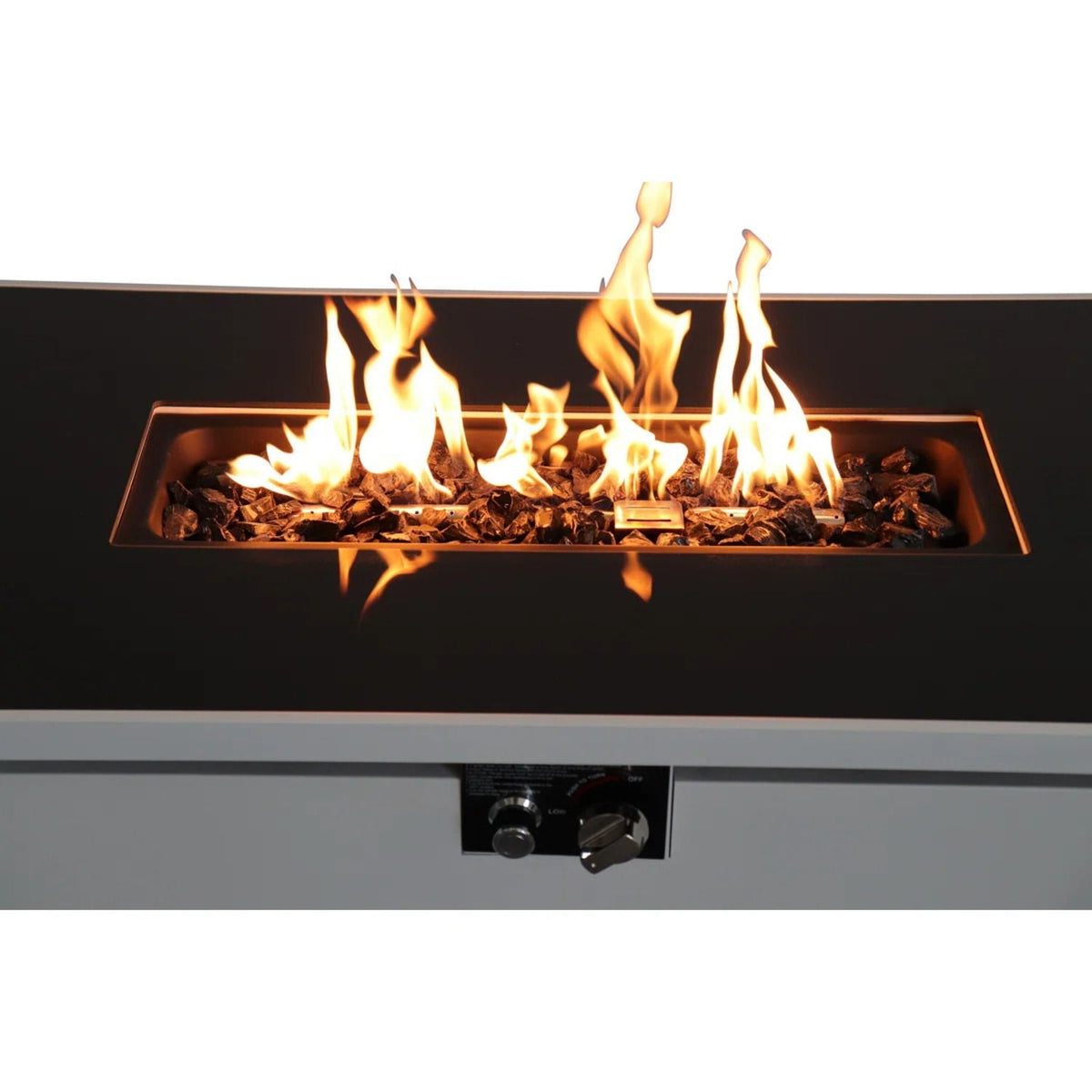 White rectangular fire pit table with black fire tray and tall flames at center
