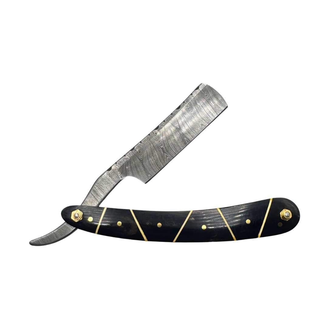 Straight razor with black handle, gold inlay, and damascus-style silver blade
