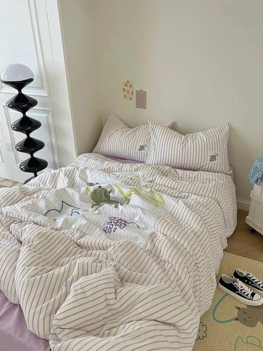 Duvet cover set featuring white-and-lilac stripes and appliqued animal motifs