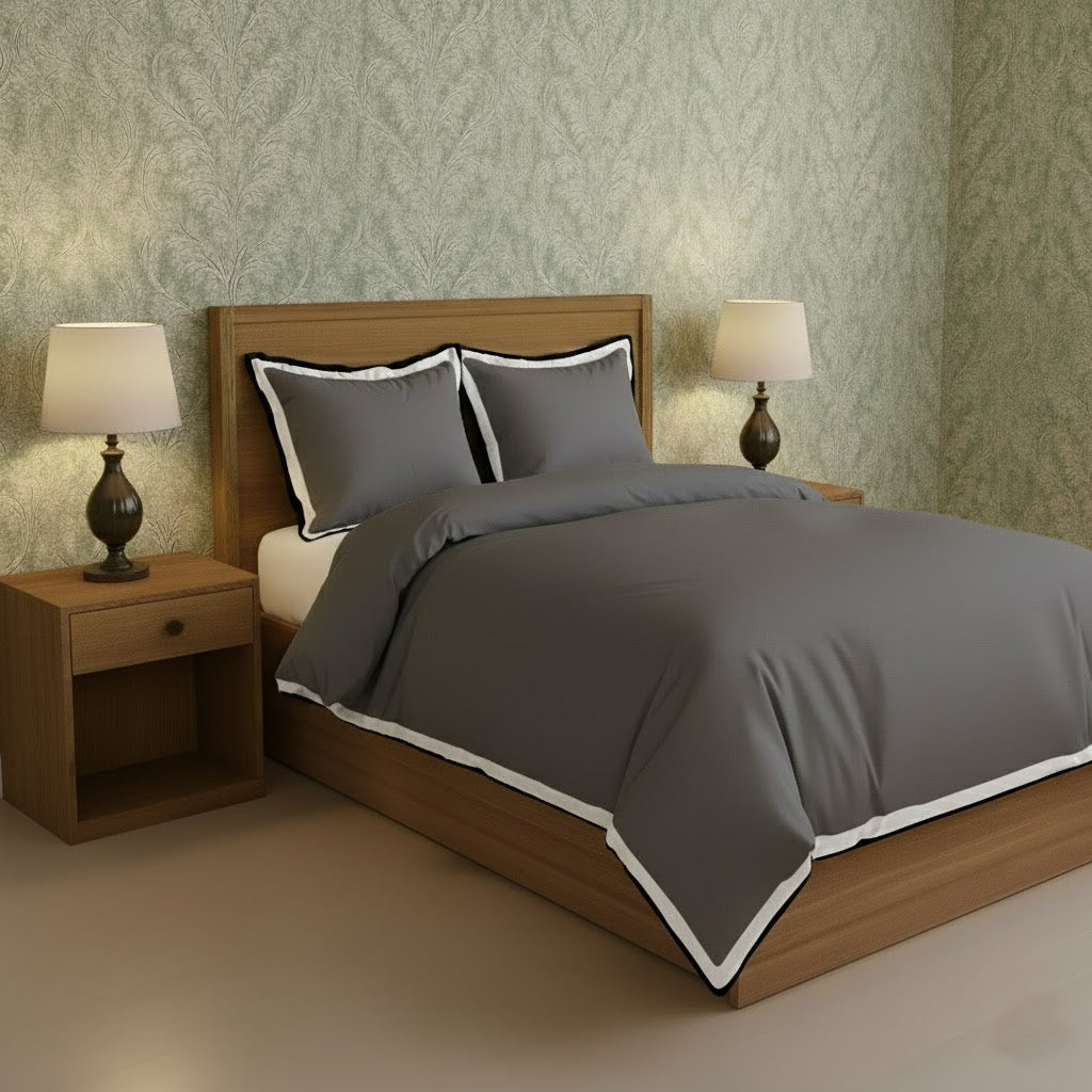 Dark gray duvet cover set with white border frame and matching pillowcases