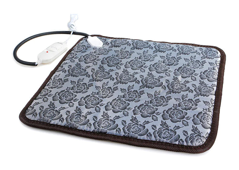 Gray heated pet blanket with rose pattern, brown edging, and attached power cord