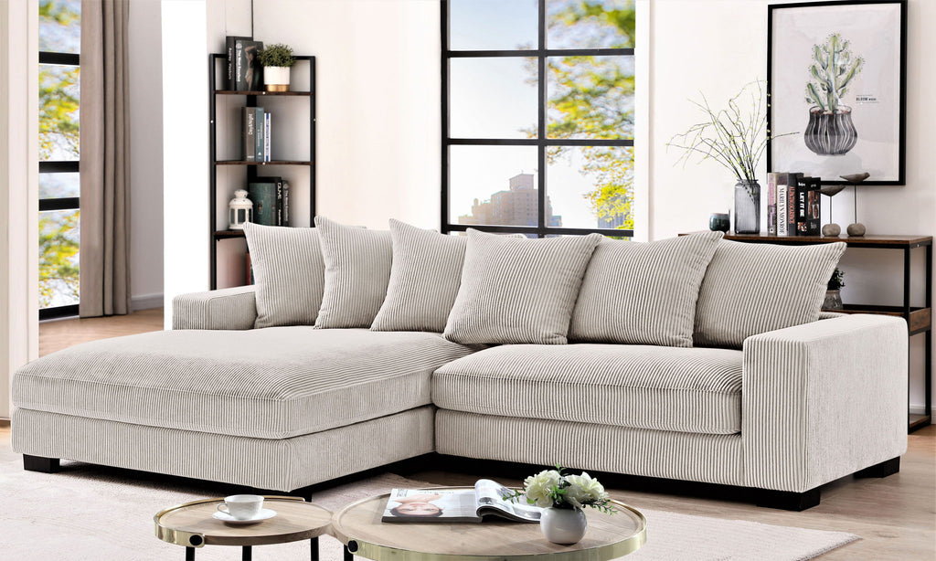 Light gray L-shaped sectional sofa with chaise and cushioned back pillows