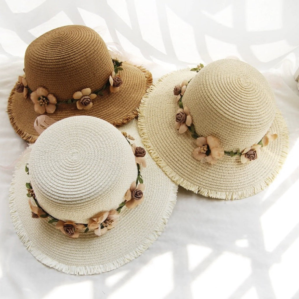 Womens straw sun hats in beige and cream with floral bands and frayed brims