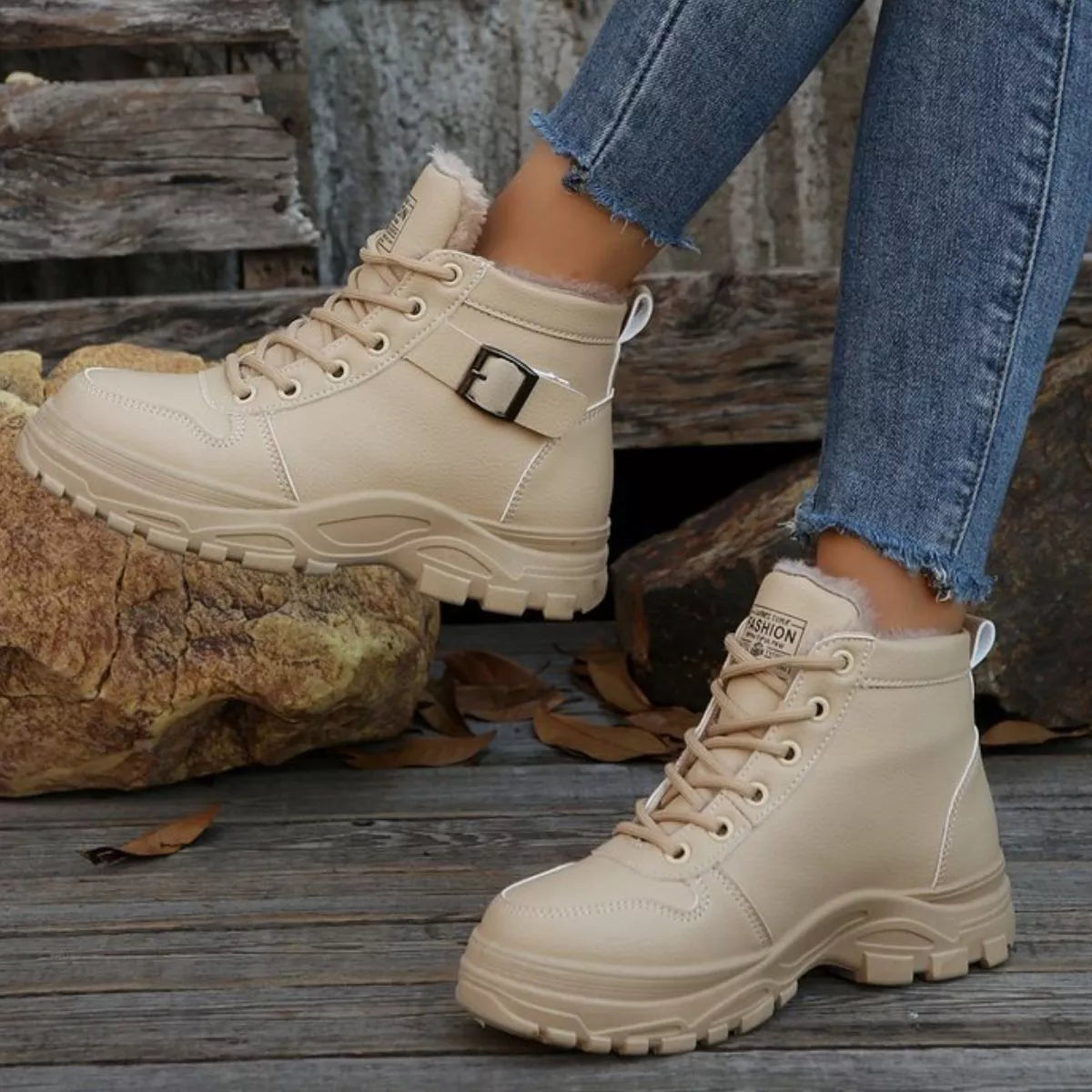 Beige warm-lined ankle boots with lace-up closure and side buckle detail