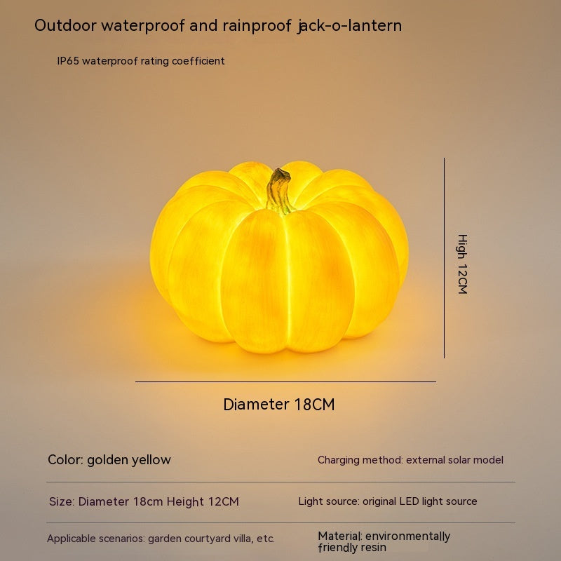 Golden yellow large pumpkin-shaped outdoor LED light with hanging loop, size shown