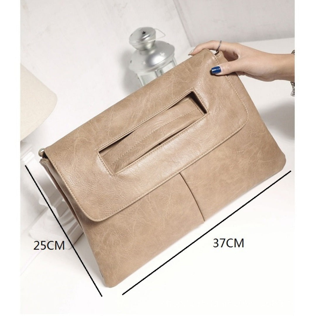 Beige suede-look envelope clutch purse with front slip pocket and flap closure