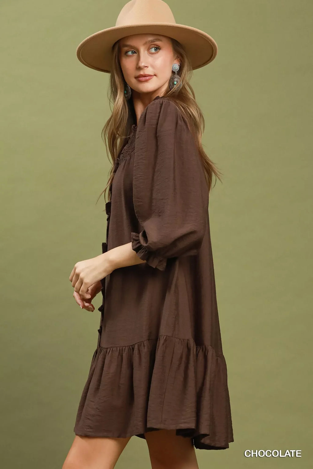 Chocolate-brown tiered mini dress with button front, gathered cuffs, and ruffle hem.
