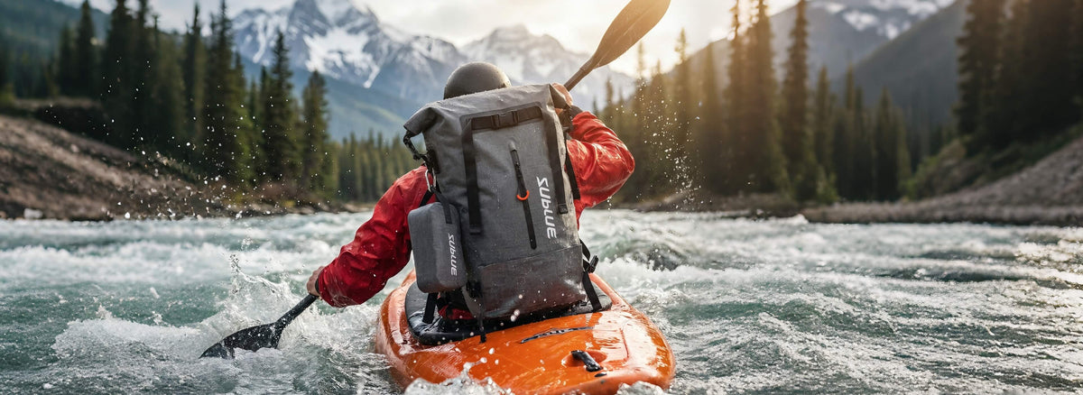 Waterproof backpack 30L in dark gray on a kayak, with top flap and side straps