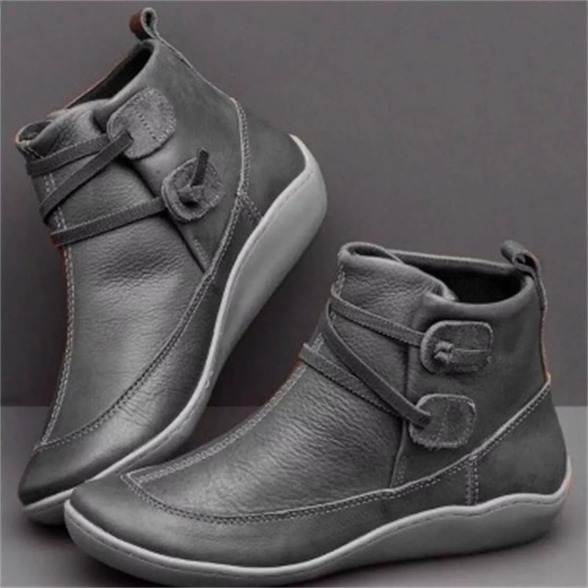 Charcoal lace-up ankle boots with button-detail strap and soft padded collar.