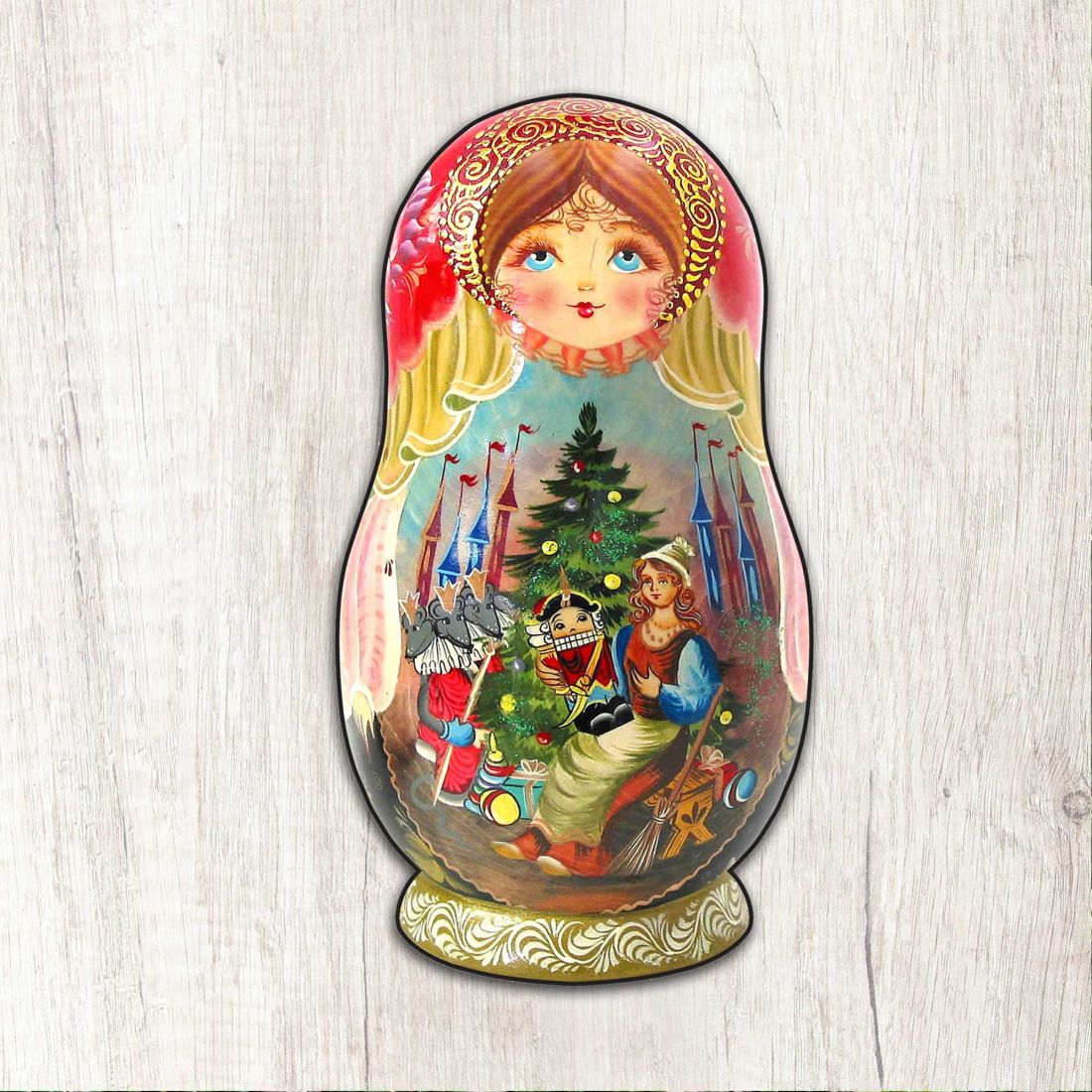 Large nesting doll ornament with nutcracker scene and angel-faced character
