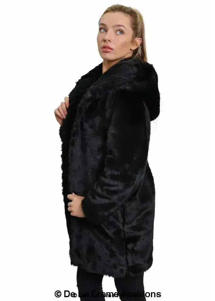 Women’s black faux fur hooded winter jacket, side view with hood and front flap.