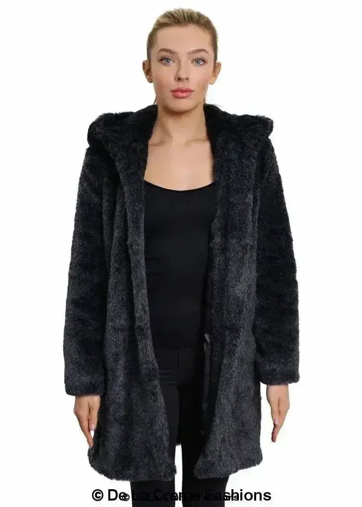 Women’s black faux fur hooded winter jacket, front view with wide hood and pockets.