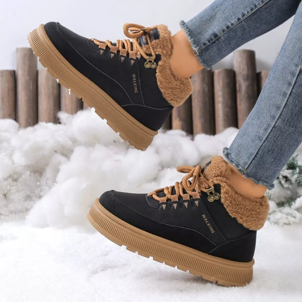 Black lace-up platform ankle boots with tan faux-fur lining and thick rubber sole