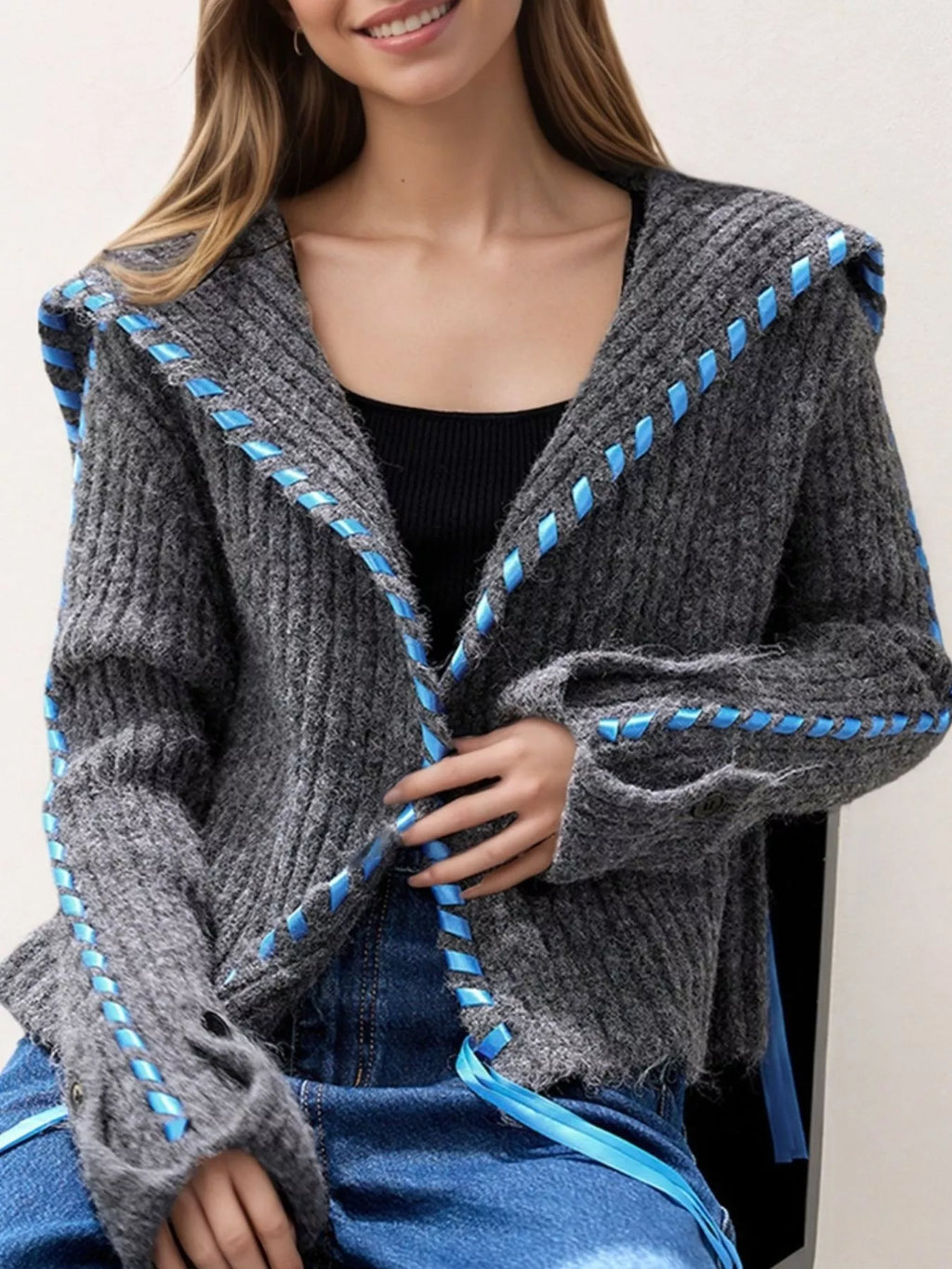 Gray ribbed knit open-front cardigan with blue trim, patch pocket, and button front