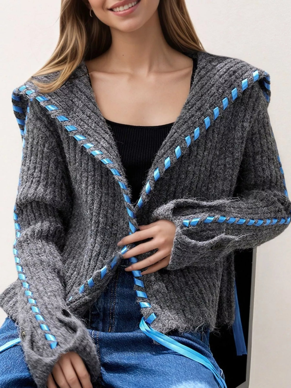Gray ribbed knit open-front cardigan with blue trim, patch pocket, and button front