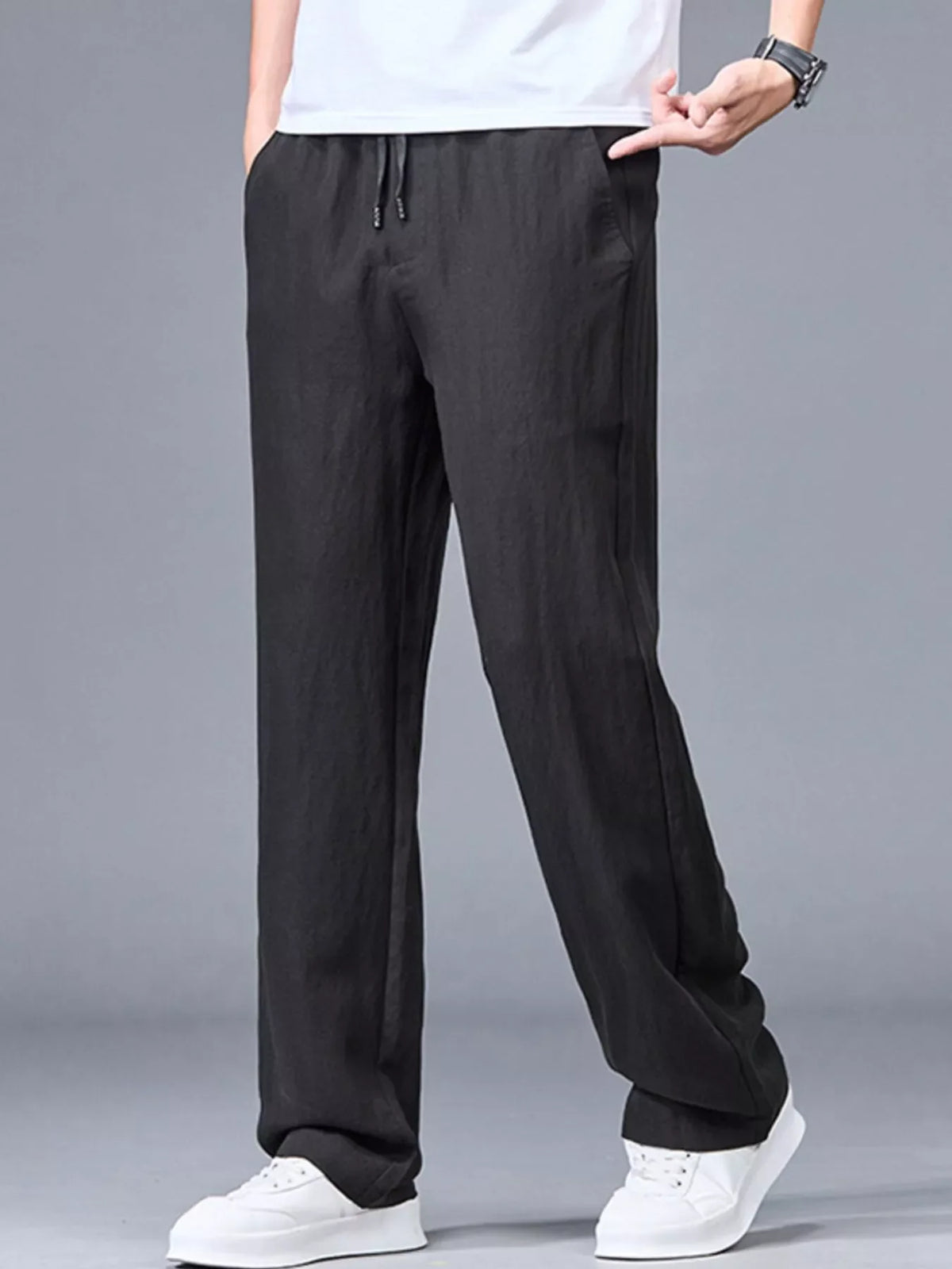 Lightweight casual pants in black, relaxed fit with drawstring elastic waist and side pockets