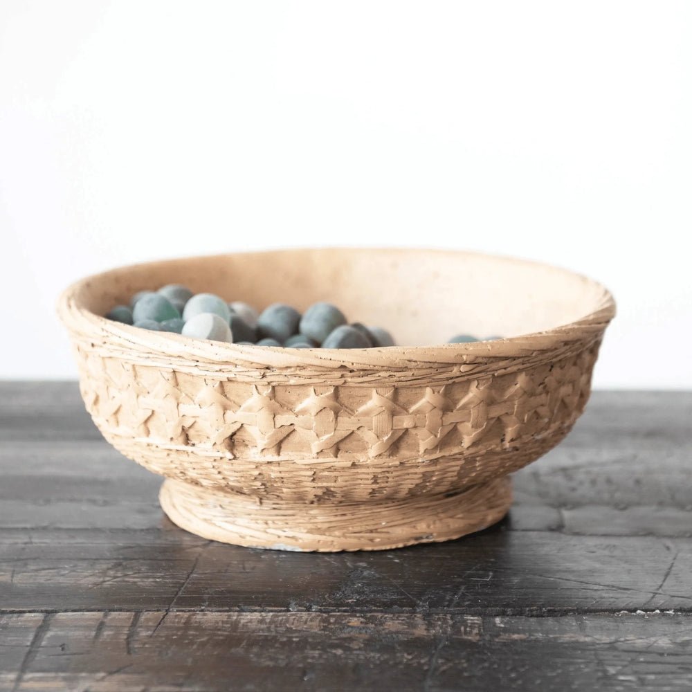Decorative cement planter bowl in light tan with woven debossed texture