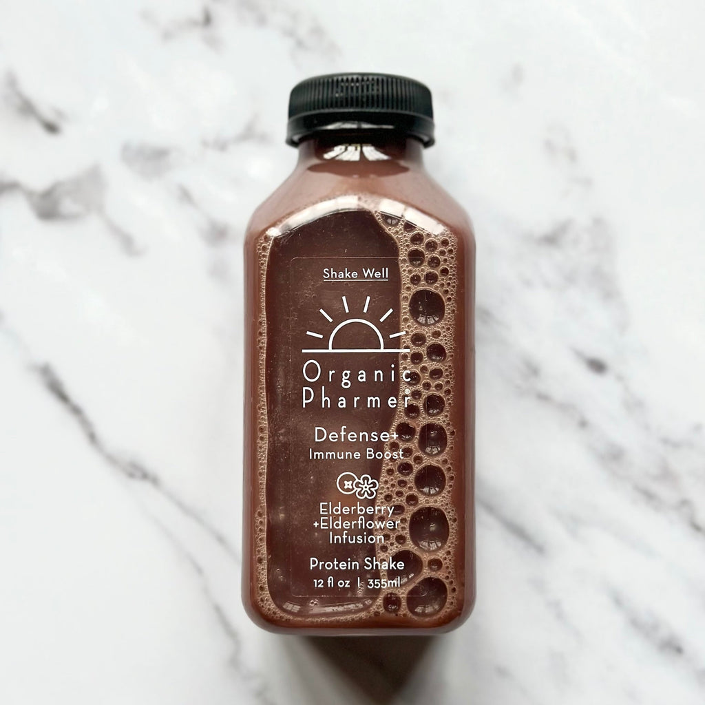 Organic Pharmer Defense+ protein shake bottle with Elderberry infusion label