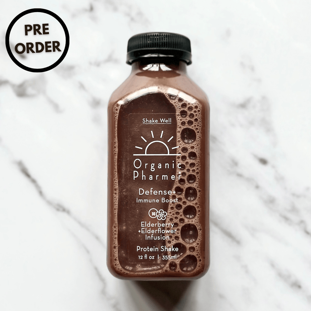 Organic Pharmer Defense+ immune boost protein shake bottle, dark brown label