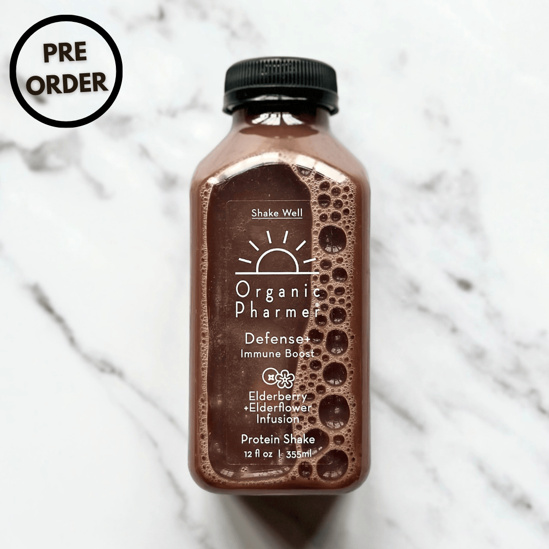 Organic Pharmer Defense+ immune boost protein shake bottle, dark brown label