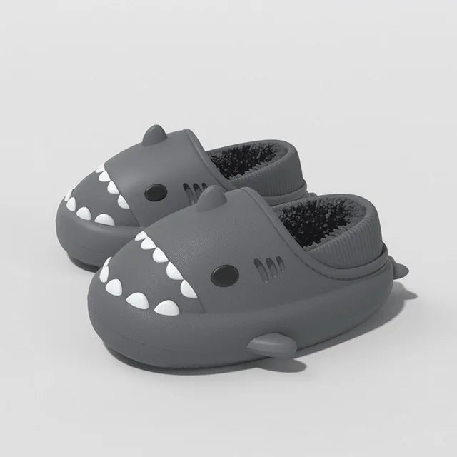 Dark gray kids shark slippers with plush lining and white tooth pattern