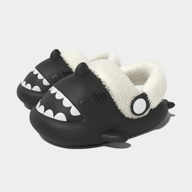 Black kids shark slippers with plush-lined cuff and white tooth pattern