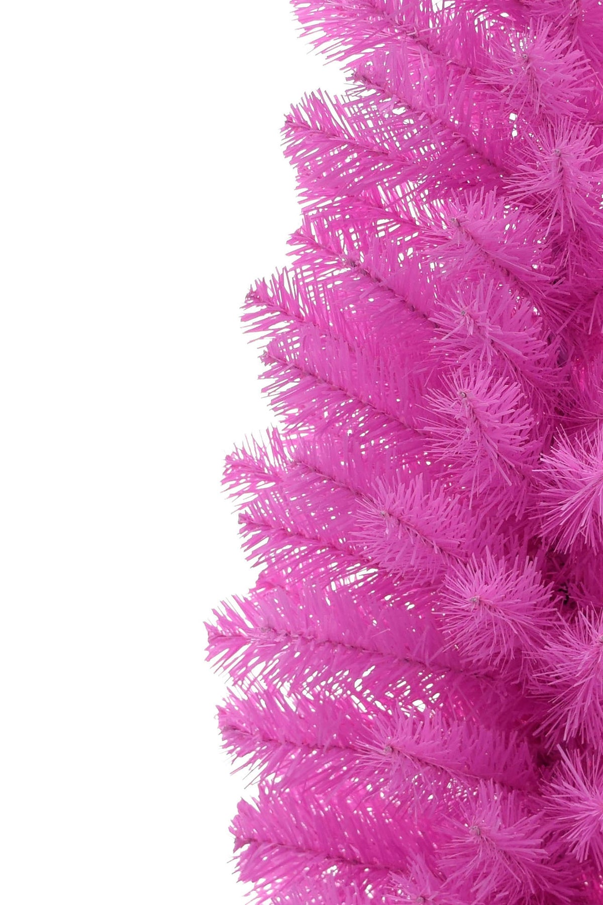 Close-up of pink tabletop Christmas tree branches on the tree