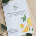 Detox book cover with title text and illustrated fruit and herb graphics