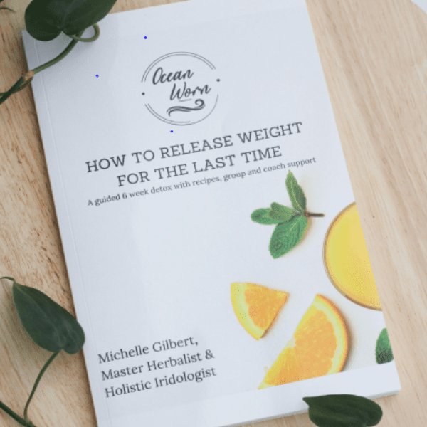 Detox book cover with title text and illustrated fruit and herb graphics