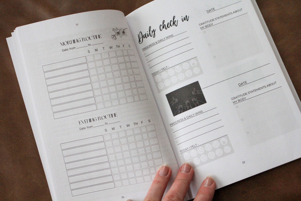 Detox book open to tracking pages with checkbox grids and section labels