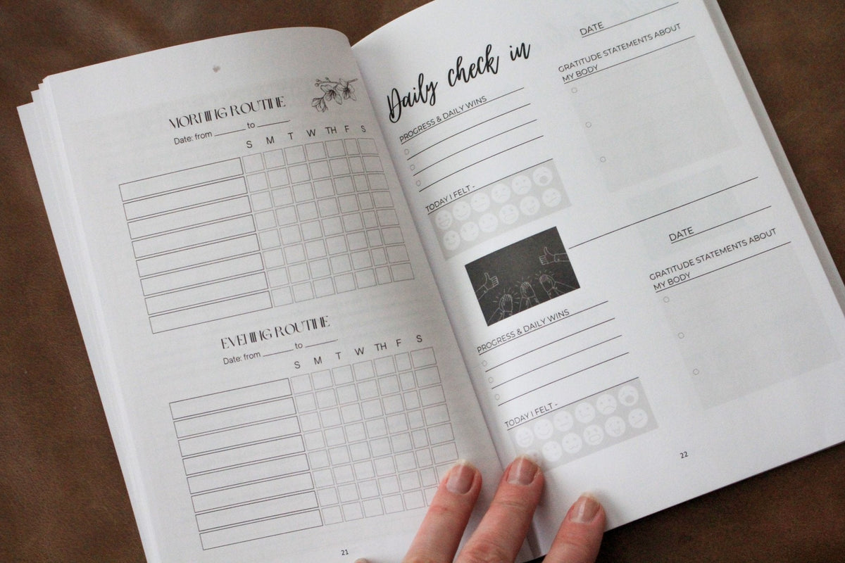 Detox book open to tracking pages with checkbox grids and section labels