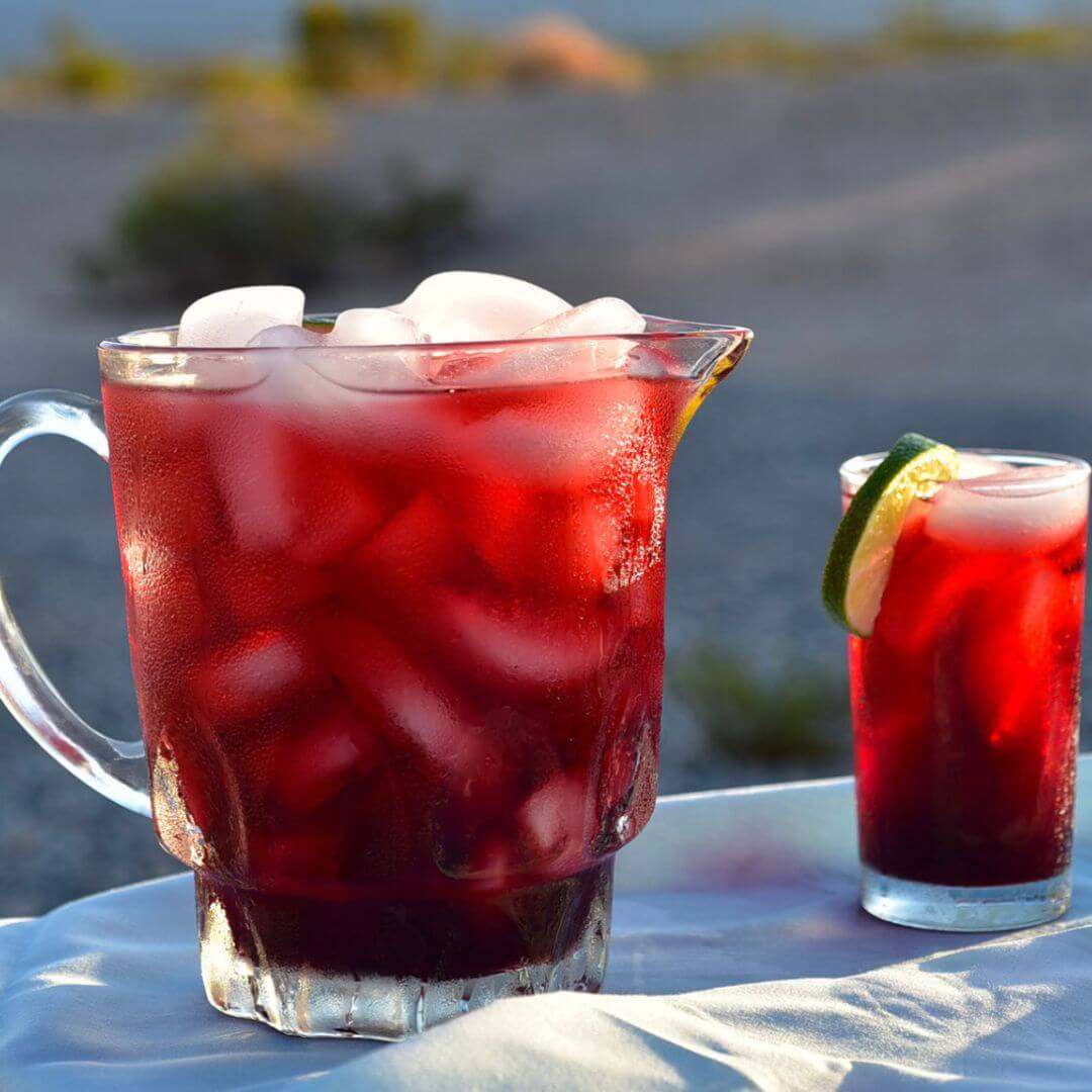 Iced detox tea in clear glasses with ice and lime slice garnish